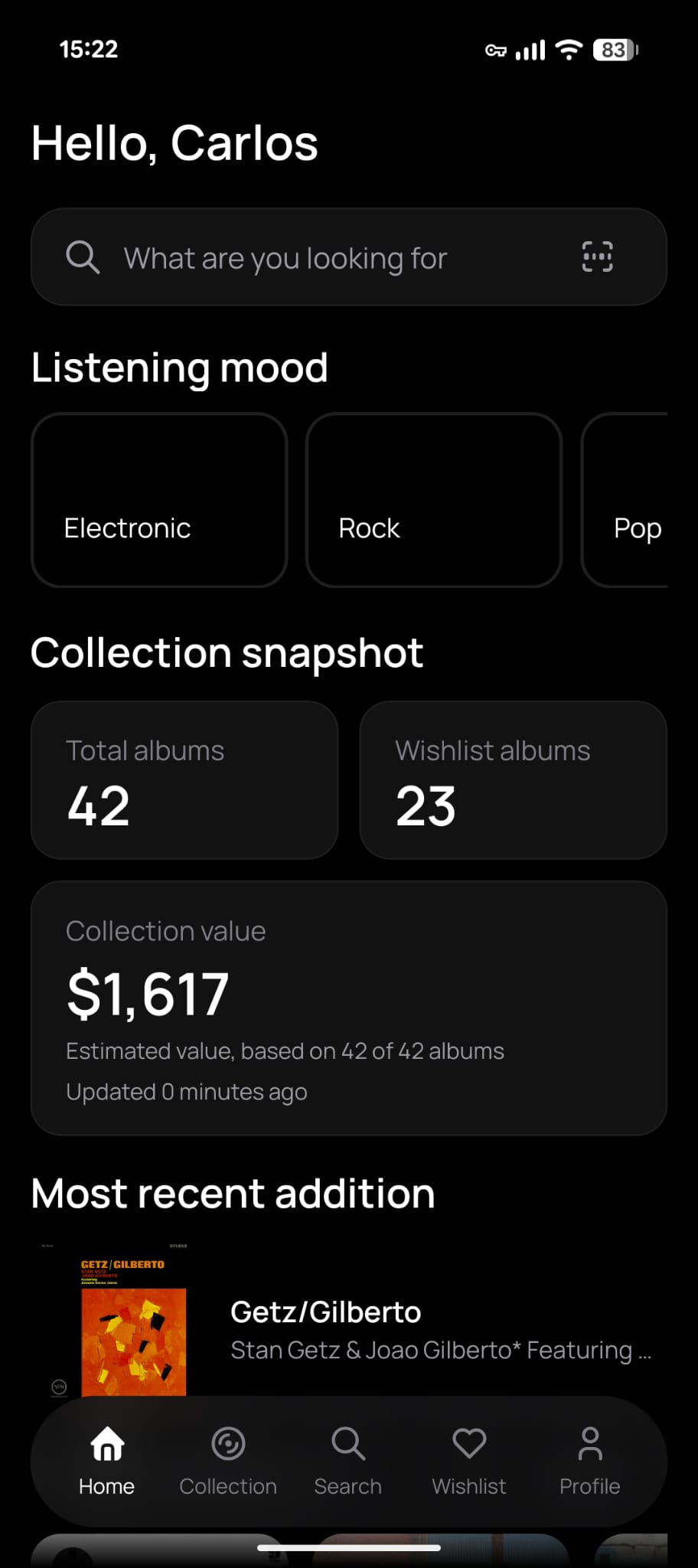 Veenyl app home screen showing collection snapshot, search, wishlist, and latest additions.