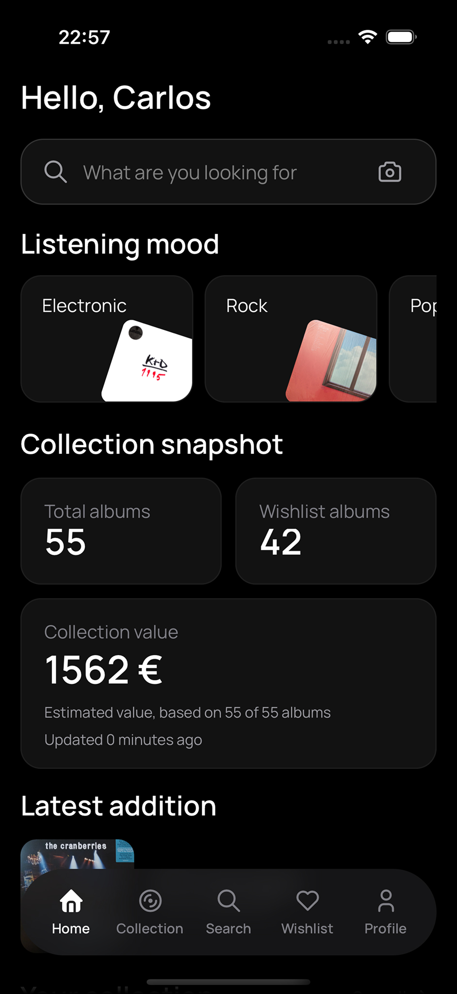 Veenyl app home screen showing collection snapshot, search, wishlist, and latest additions.